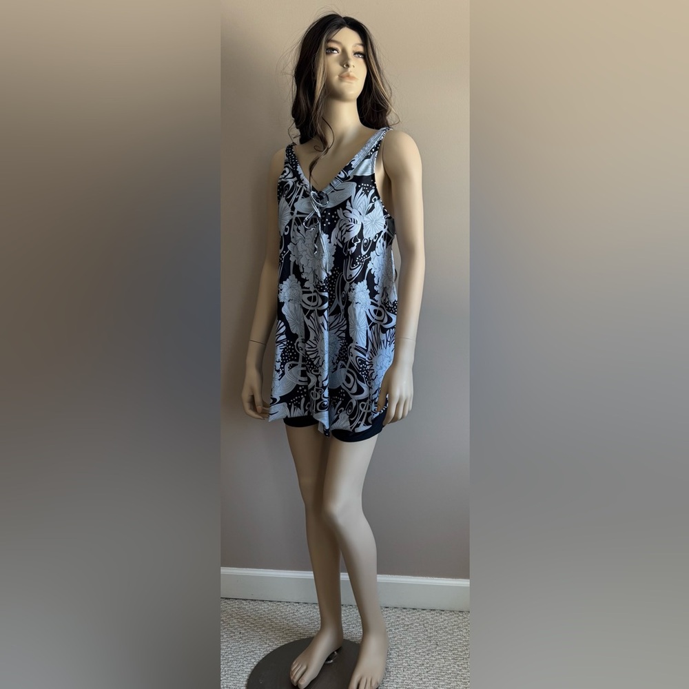 Black and White Floral tankini with short swim shorts.